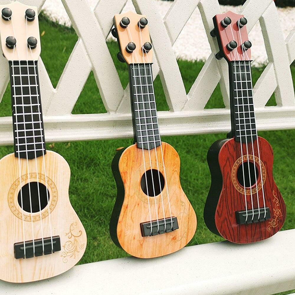 Mini guitare classique à 4 cordes pour enfant • Enfant World