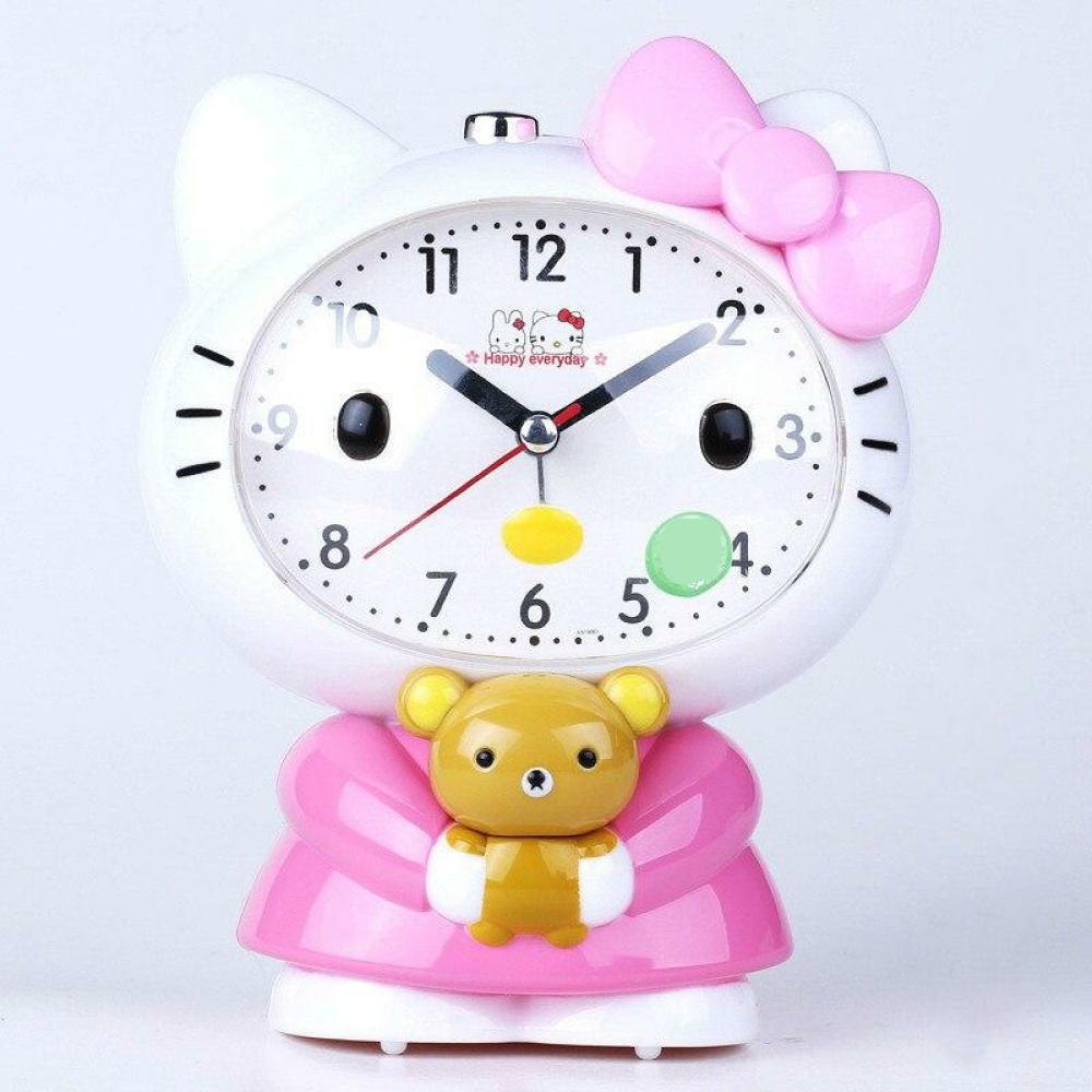 Réveil en forme Hello Kitty pour enfant, couleurs rose et blanc. Bonne qualité et très pratique.
