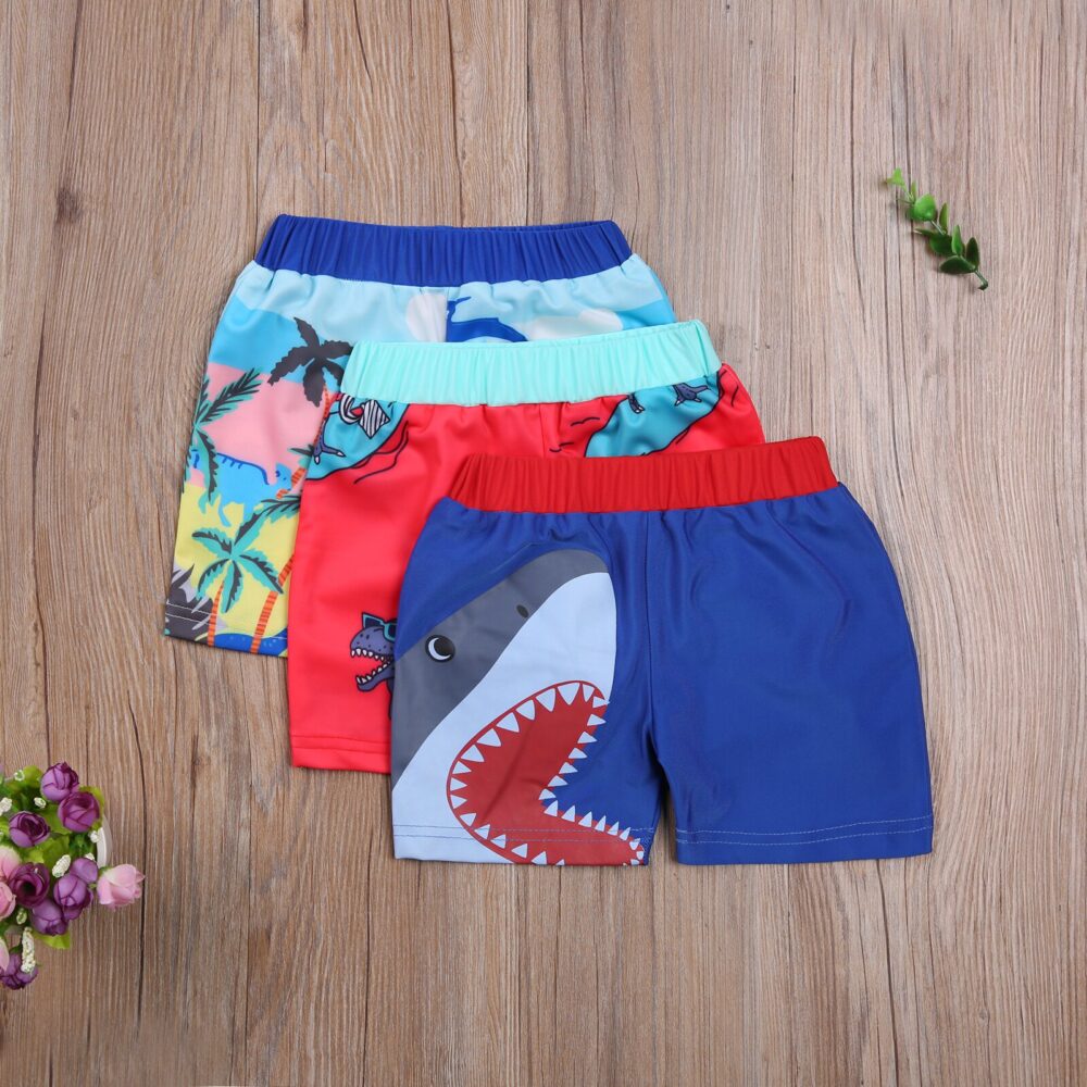 Short de plage motif dessin animé pour enfant coloré avec fond en bois
