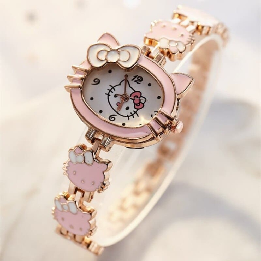 Bracelet montre en forme Hello Kitty pour enfant rose et doré sur fond blanc