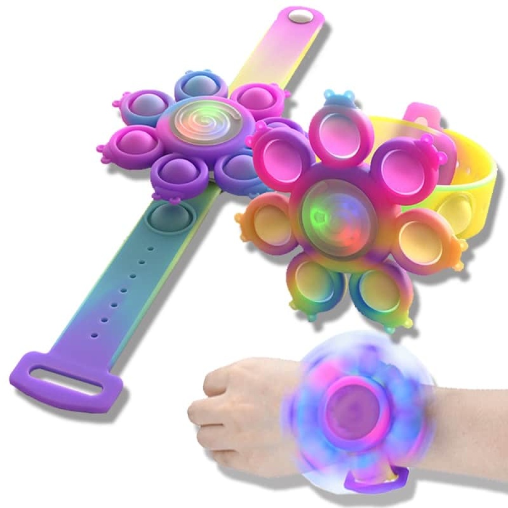 Bracelet Anti-stress spin "Pop it" coloré violet style arc en ciel sur le poignèe d'une fille