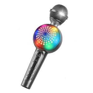 Un micro de karaoké sans fil gris pour enfant avec un haut-parleur en son centre multicolore