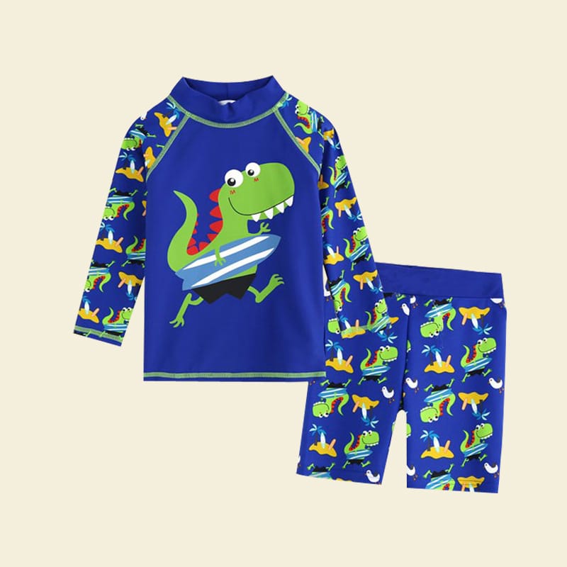 maillot pour enfant, bleu, avec un dessin de dinosaure dessus, composé d'un tee-shirt manches longues et d'un short